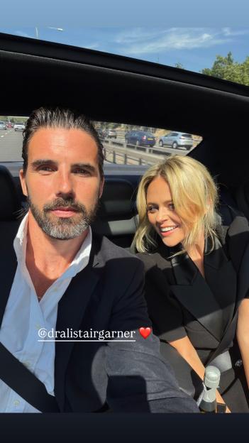 Emily Atack and Dr Alistair Garner taking a selfie in the back of a car.