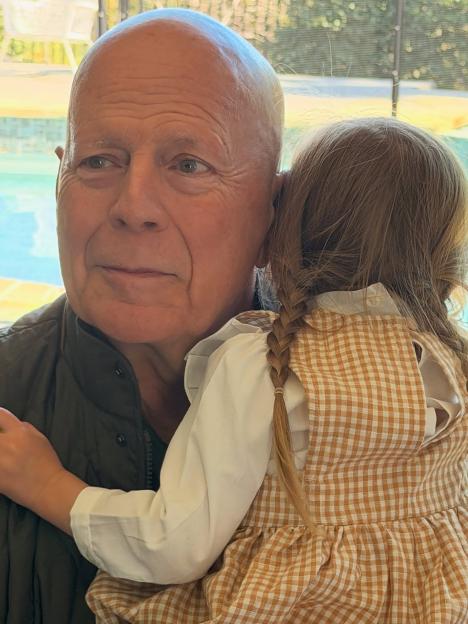 Bruce Willis holding his granddaughter Louetta.