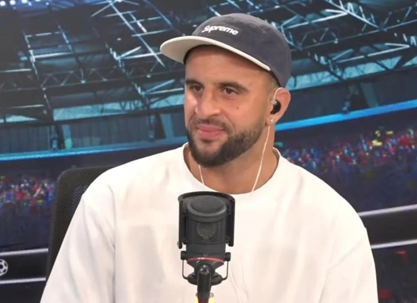Kyle Walker on TalkSport speaking into a microphone.