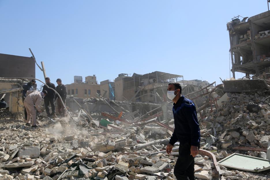 View of heavy damage around Ferdowsi Square in central Tehran following U.S. and Israeli strikes on Iran, with debris scattered across nearby buildings.