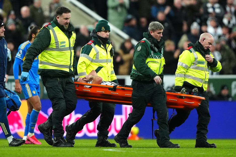 Newcastle's Fabian Schar Leaves the Pitch on a Stretcher with Leg Brace During Leeds Match