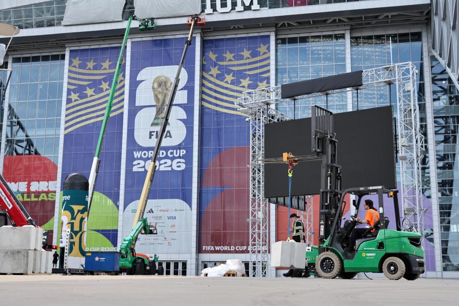 Workers prepare AT&T Stadium for the transition of signage to Dallas Stadium for the FIFA World Cup 2026.