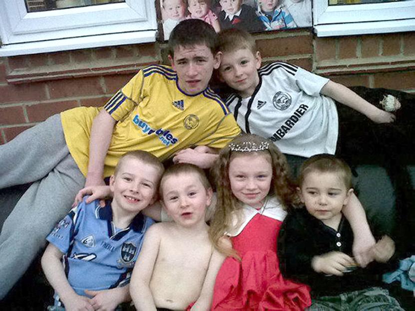 Duwayne, John, Jayden, Jade, Jesse, and Jack Philpott, from left to right, seated or lying down.