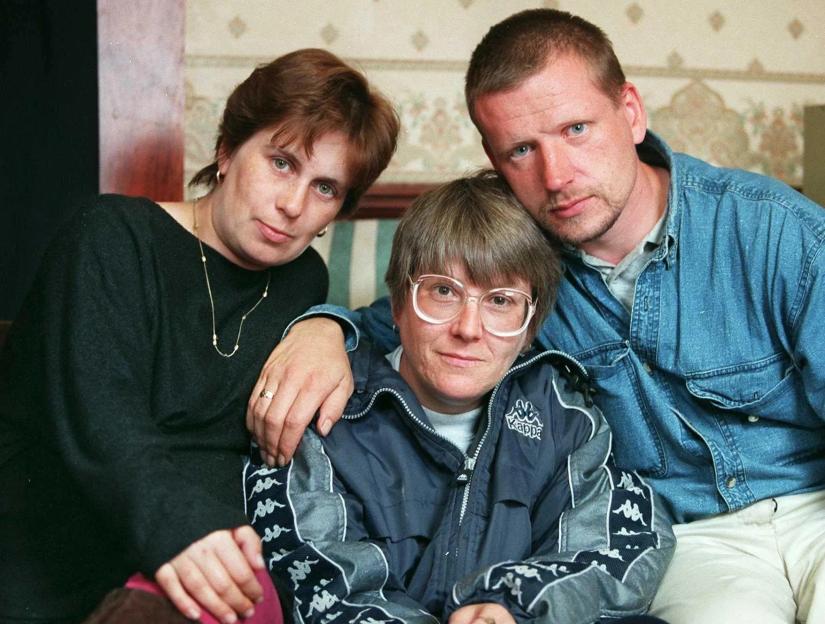 Faye Stafford, Karen Lavis (center), and Darren Vickers (right) at Faye Stafford's home.