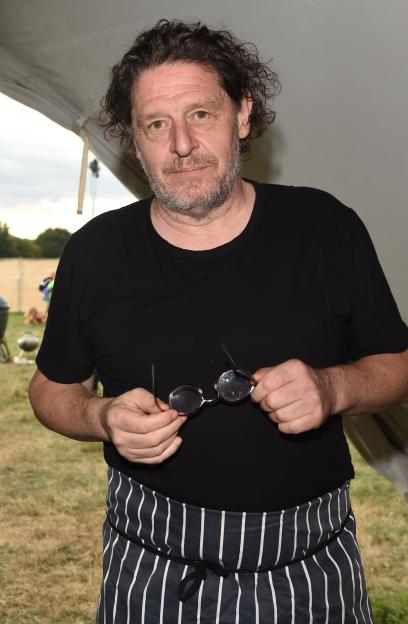 Chef Marco Pierre White holding his glasses at The Big Feastival.