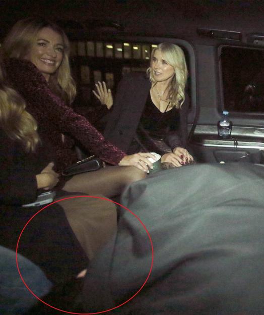 EXCLUSIVE PICTURES NO USAGE WITHOUT PERMISSION FROM JAMES CURLEY AND MAGICMOMENTSUK..NEWLY SINGLE CAT DEELEY IS SEEN ARRIVING AT THE FASHION AWARDS IN LONDON WITH ARSENAL FOOTBALLER DECLEN RICE IN THE SAME TAXI AND WAS SEEN TRYING TO HIDE BY DUCKING