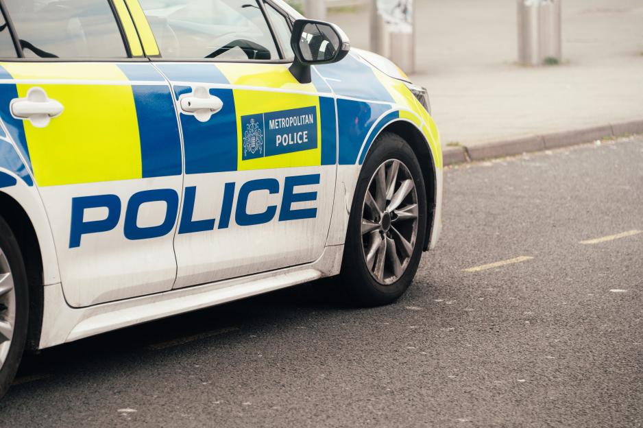 A Metropolitan Police car parked on a street in the UK.