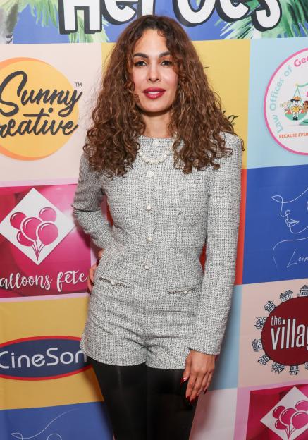 Nadine Velazquez in a gray tweed playsuit and pearl necklace at the Los Angeles Fire Department Heroes celebration.