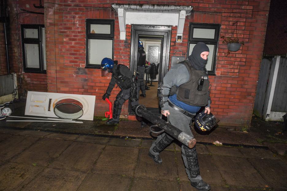 Police conducting a drug raid at a home in Swinton, Greater Manchester.