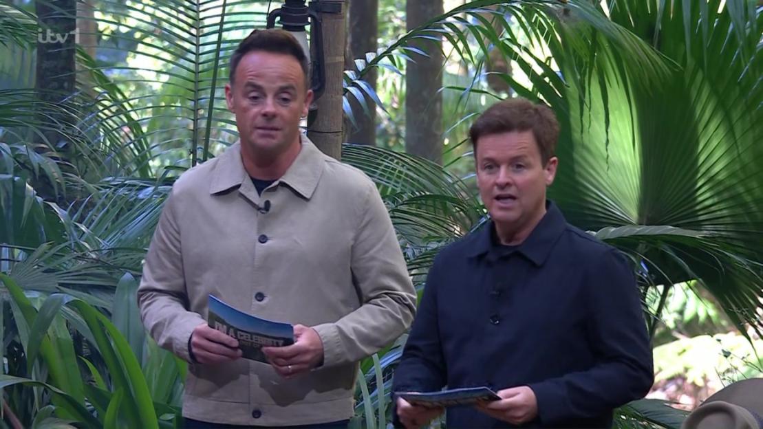 Ant and Dec holding note cards on a jungle set.