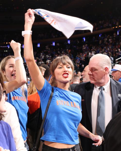Taylor Swift celebrating at an NBA Finals game.