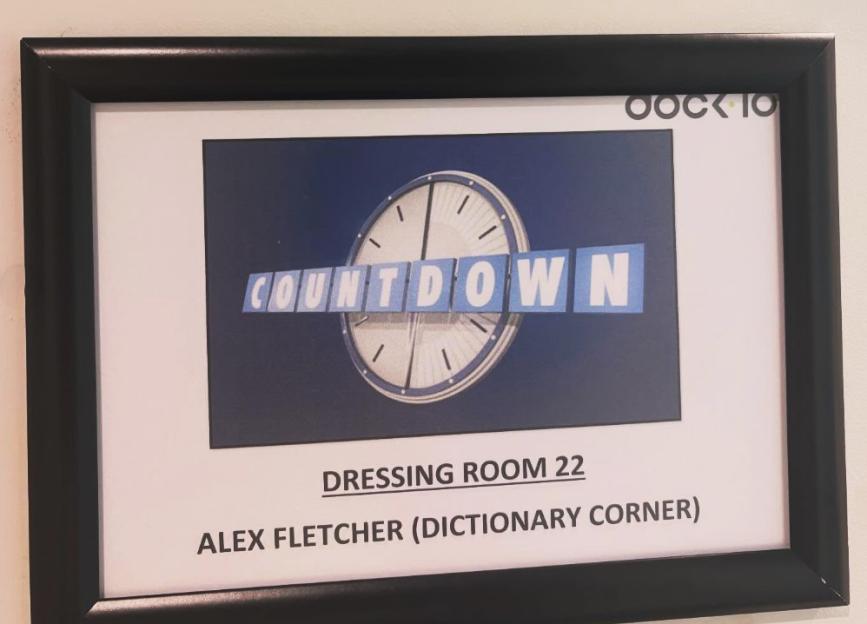 Framed sign for Dressing Room 22 on the set of Countdown, designated for Alex Fletcher (Dictionary Corner).