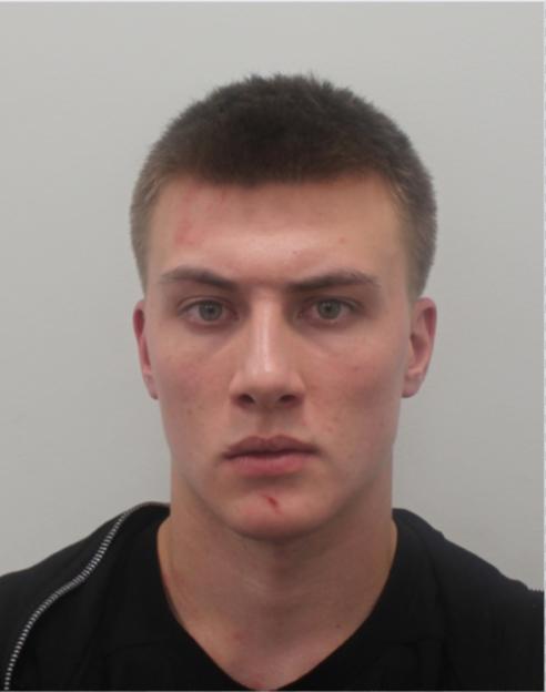 Mugshot of wanted criminal Alexsandr Vladimirovich Kuksov.