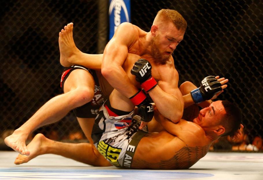 Illustration comparing Conor McGregor and Max Holloway's fighting statistics.