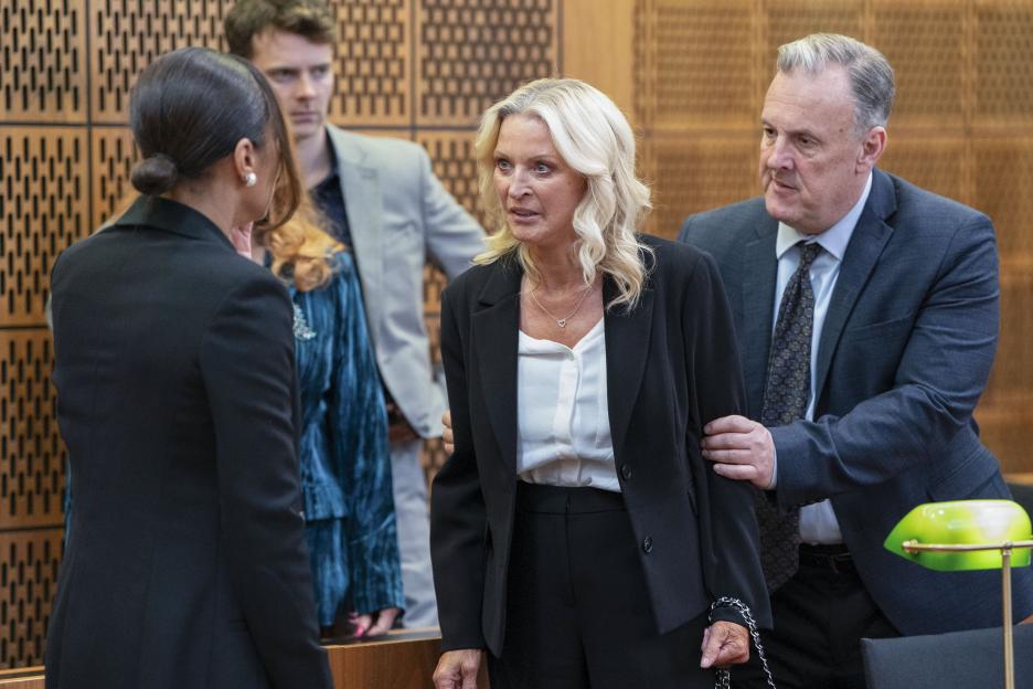 Elaine Knight, supported by Ross and Chelsea Fox, confronts an unknown man.