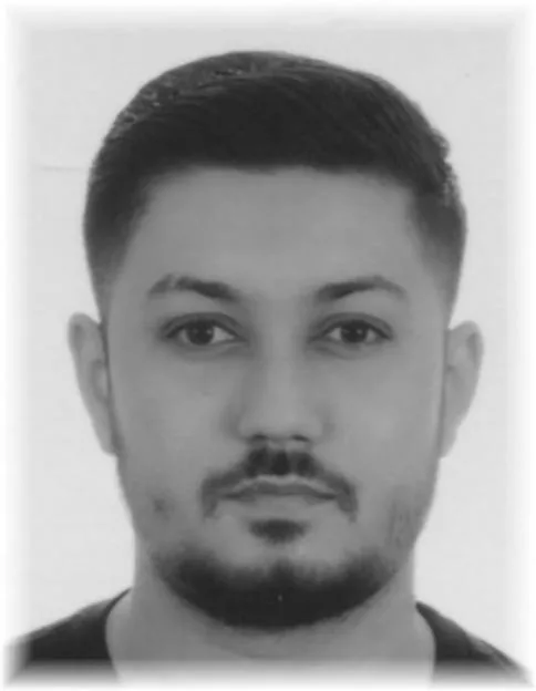 Black and white portrait of Dariusz Paczkowski.