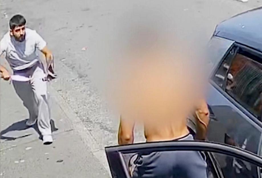 Shocking moment thug pulls huge zombie knife from trousers and stabs man twice in broad daylight street attack after row