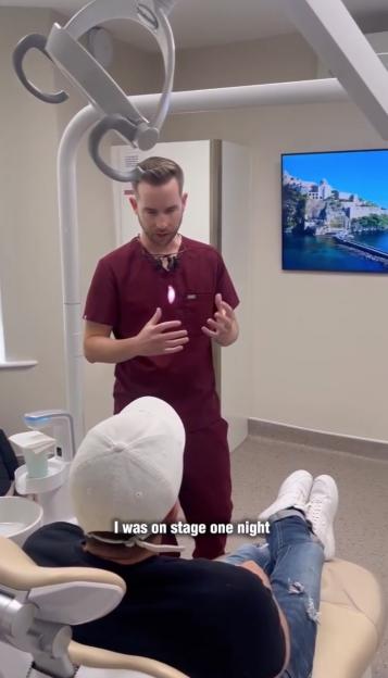 Peter Andre in a dentist chair being examined by a dentist.