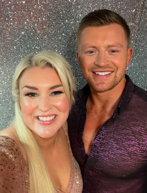 Sara Davies with an unknown man.