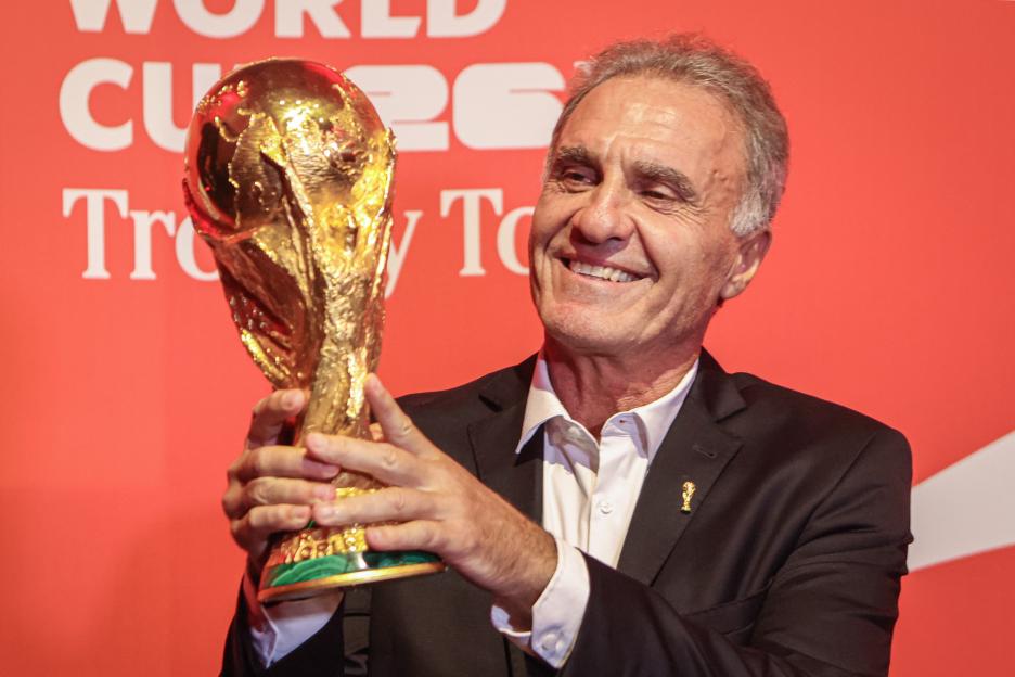 Oscar Ruggeri, a member of Argentina’s 1986 FIFA World Cup-winning team, holding the FIFA World Cup trophy.