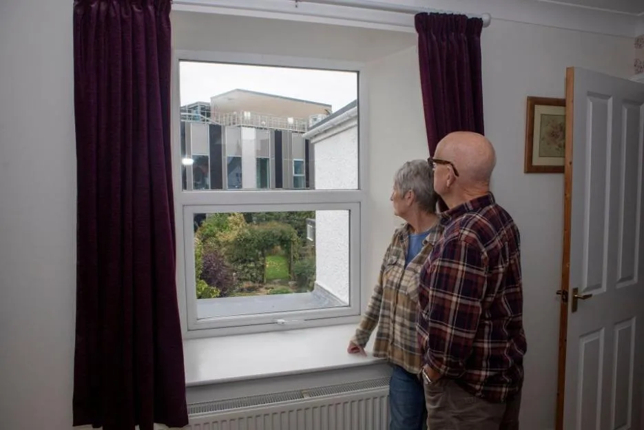 Tom and Hilda Young look out of their window at the new Berwick Community Hospital construction site.