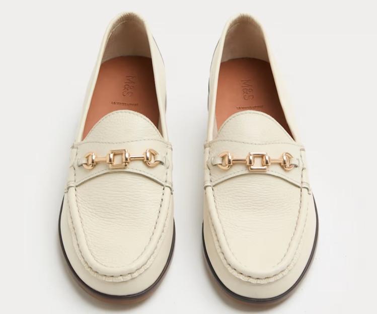 Pair of M&S cream leather loafers with gold-toned horsebit details.