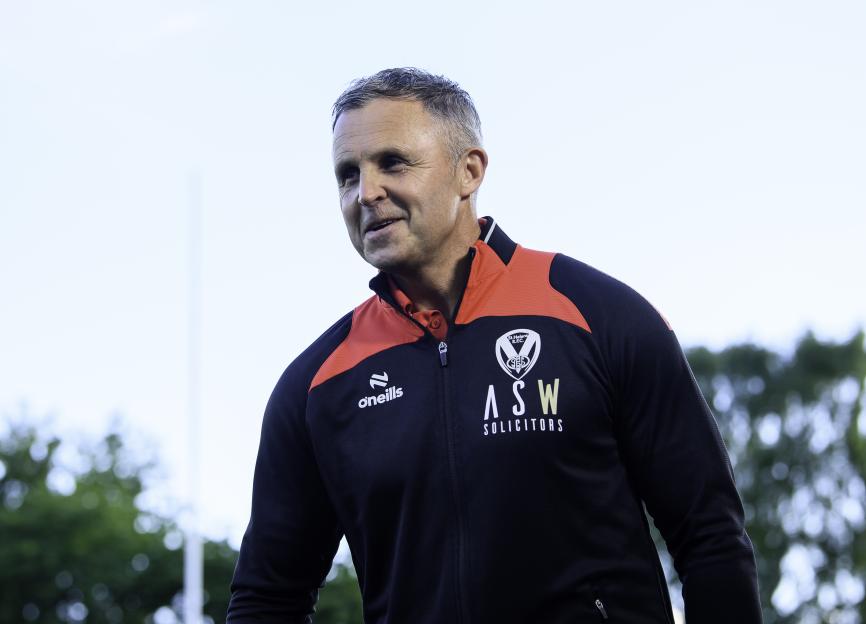 Paul Rowley, coach for St Helens, wearing a black jacket with red trim.