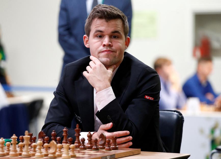 FILE PHOTO: Chess - 2018 World Rapid and Blitz Chess Championships - Rapid Open - Saint Petersburg, Russia - December 26, 2018. Magnus Carlsen of Norway plays against Adam Tukhaev of Ukraine. REUTE...