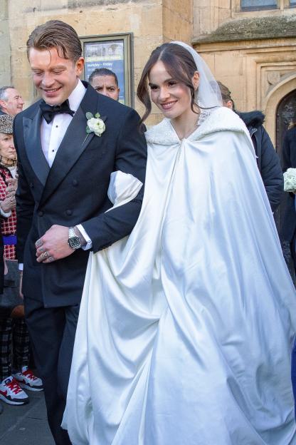Olympic swimmer Adam Peaty and Holly Ramsay leaving Bath Abbey after their wedding.