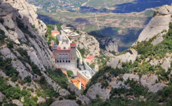 Monastery of Montserrat nestled among rocky mountains.