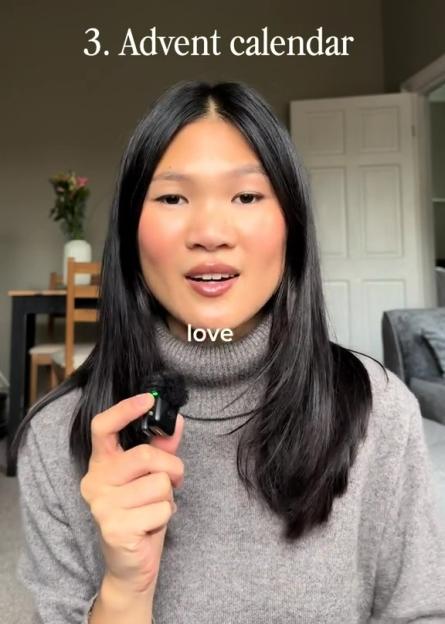 A woman holding a microphone and talking, with text overlay reading "3. Advent calendar" and "love".