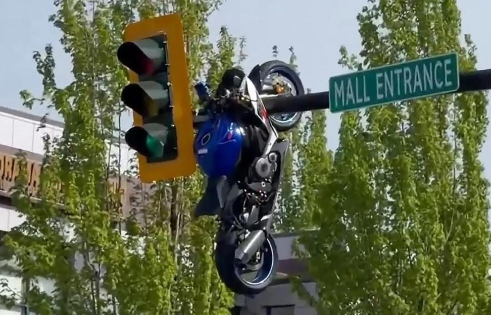 Shocking Video Captures Motorcycle Dangling from Traffic Light After Biker's Harrowing Crash
