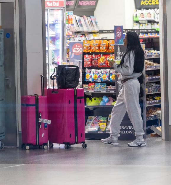 Excl - Katie Price has been spotted at Gatwick Airports North Terminal, checking in business class for a swanky Emirates flight to Dubai ? despite frantic pleas from those closest to her..Pals tell The Sun that friends and family have been desperatel