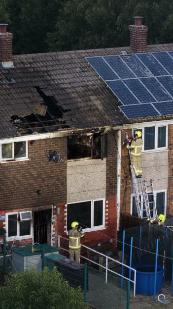 Firefighters investigate a house fire in Knottingley.