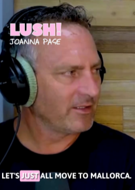 A man wearing headphones with "LUSH! JOANNA PAGE" in pink text in the top left and "LET'S JUST ALL MOVE TO MALLORCA." in white text below.