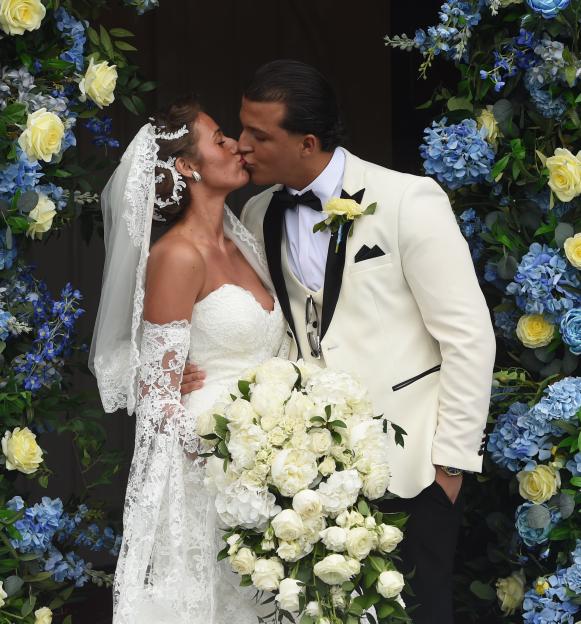 Venezuela Fury kissing Noah Price at their wedding.