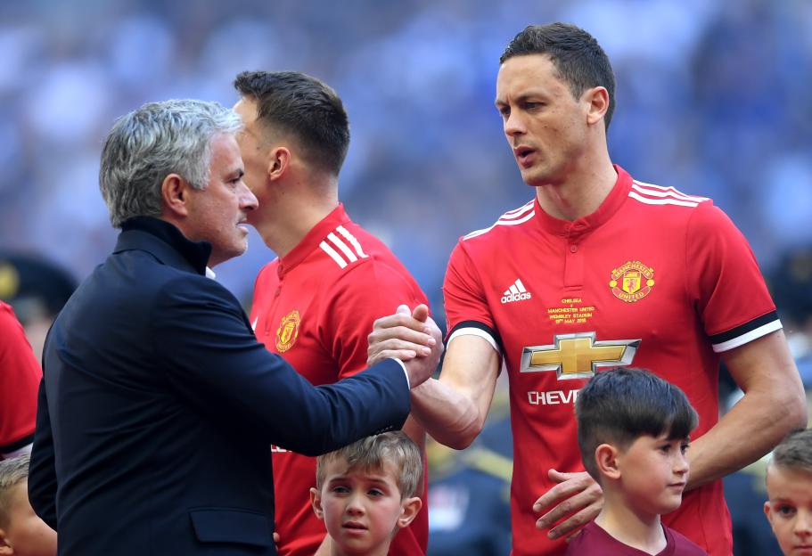 Manchester United Manager Jose Mourinho shaking hands with Nemanja Matic.