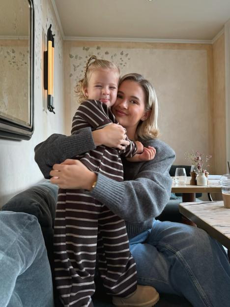 Molly Mae holding Bambi.