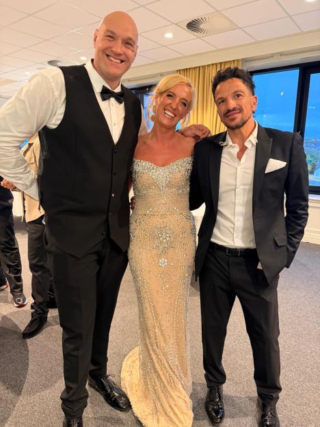 Tyson Fury, Paris Fury, and Peter Andre posing together.