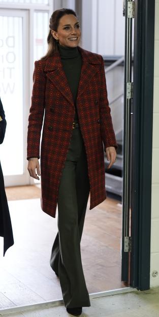 Catherine, Princess of Wales, smiles while arriving for a visit to Hiut Denim, a company that designs and manufactures jeans.