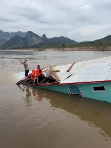 Shocking footage shows tourists cry for help as water submerges sinking Laos ferry