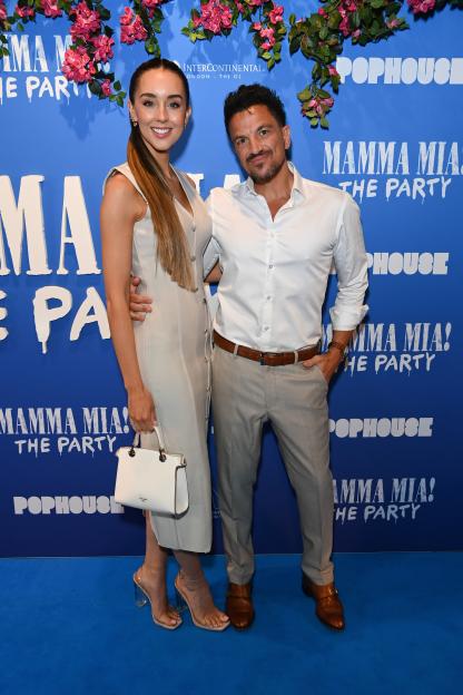 Emily MacDonagh and Peter Andre attend "Mamma Mia! The Party" gala night.