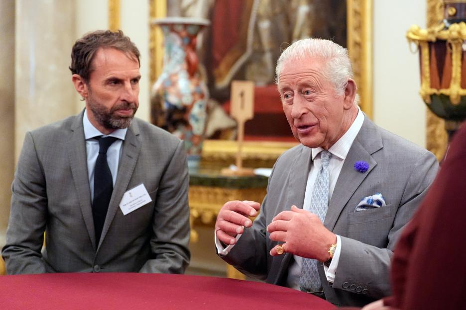 King Charles III speaking with former England football manager Gareth Southgate.