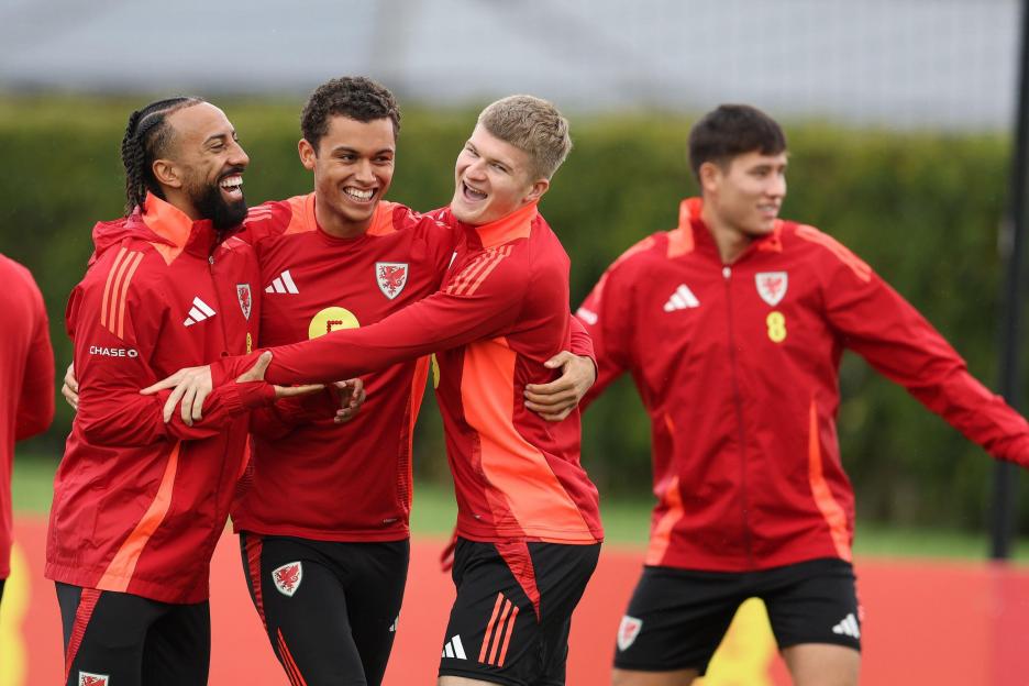 Cardiff, UK. 08th Oct, 2025. Sorba Thomas (l), Brennan Johnson (c) & Jordan James of Wales (r) share a joke. Wales football team training at Hensol, Vale of Glamorgan in South Wales on Wednesday 8th October 2025. The team are training ahead of the fr