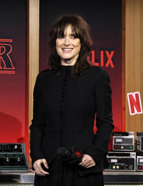 Winona Ryder smiling at the Stranger Things Season 5 World Premiere.