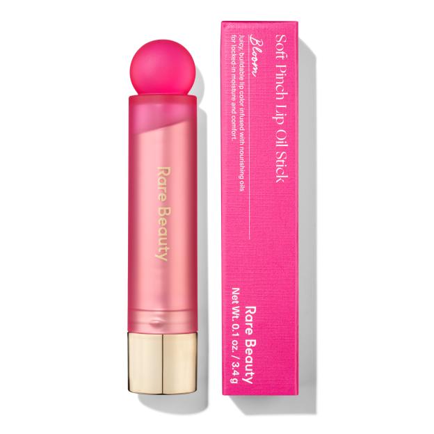 Rare Beauty Soft Pinch Lip Oil Stick in Bloom with packaging.