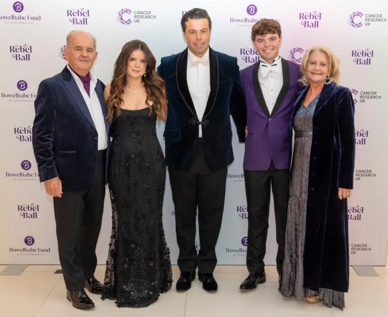 Sebastian Bowen, children Hugo and Eloise, and parents Heather and Alistair James pose at The Rebel Ball in support of the Bowelbabe Fund for Cancer Research UK.