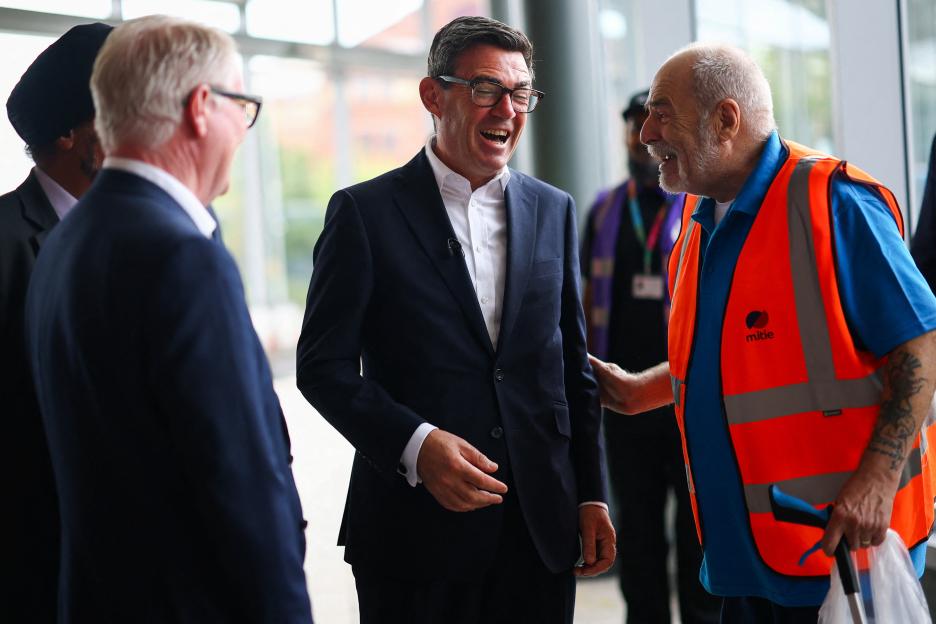 Britain's Prime Minister Andy Burnham visits a bus depot in Wolverhampton