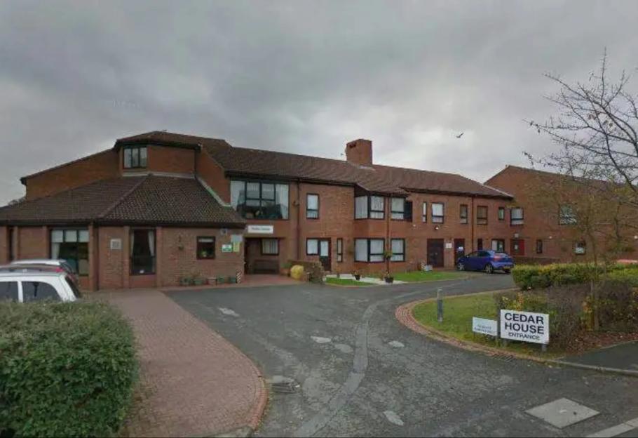 An image collage containing 1 images, Image 1 shows Exterior of Cedar House with a sign for the entrance