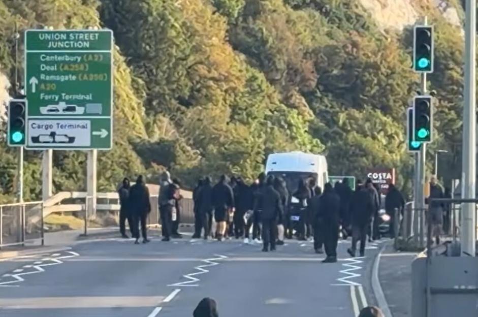 Protesters blocking a road in Dover near the Union Street Junction sign.